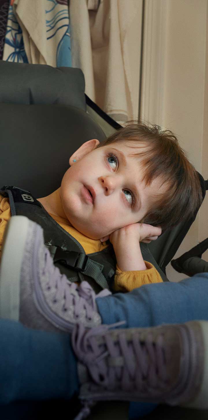 Girl sitting in a chair and looking up